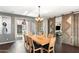 Elegant dining room with a large table and barn-style sliding doors at 2822 E Clifton Ct, Gilbert, AZ 85295