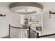 Elegant entryway showcasing a curved staircase and crystal chandelier at 2822 E Clifton Ct, Gilbert, AZ 85295