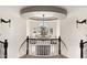 Grand entryway with a curved staircase, chandelier, and large window at 2822 E Clifton Ct, Gilbert, AZ 85295