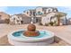 Two-story house with a circular fountain in the front yard at 2822 E Clifton Ct, Gilbert, AZ 85295