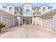 Two-story home with a three-car garage and decorative front entry at 2822 E Clifton Ct, Gilbert, AZ 85295