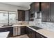 Modern kitchen with dark wood cabinets and an island at 2822 E Clifton Ct, Gilbert, AZ 85295