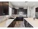 Modern kitchen with dark wood cabinets and an island at 2822 E Clifton Ct, Gilbert, AZ 85295