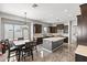 Modern kitchen with dark cabinets, an island, and ample counter space at 2822 E Clifton Ct, Gilbert, AZ 85295