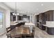 Modern kitchen with dark wood cabinets and an island at 2822 E Clifton Ct, Gilbert, AZ 85295