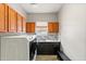 Laundry room with washer, dryer, and built-in cabinets at 2822 E Clifton Ct, Gilbert, AZ 85295