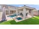 Inviting backyard oasis featuring a pool, spa, and covered patio at 2822 E Clifton Ct, Gilbert, AZ 85295