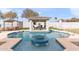 Relaxing pool area featuring a central fountain and a covered patio at 2822 E Clifton Ct, Gilbert, AZ 85295