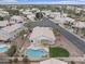 An aerial view shows a private backyard with a pool, patio, and well-manicured lawn at 2830 S Arroyo Ct, Chandler, AZ 85286