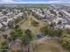 Overhead view of a neighborhood park featuring playground equipment, walking paths, and mature trees at 2830 S Arroyo Ct, Chandler, AZ 85286