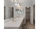 Bright bathroom with double sinks, quartz countertops, and modern fixtures offers lots of space at 2830 S Arroyo Ct, Chandler, AZ 85286