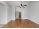 Bedroom with ceiling fan, natural light, and wood floors at 2830 S Arroyo Ct, Chandler, AZ 85286