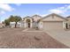 Charming single-story home featuring a well-maintained yard with desert landscaping, neutral color palette, and arched entryway at 2830 S Arroyo Ct, Chandler, AZ 85286