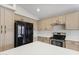 Spacious kitchen with stainless steel appliances, ample counter space, and light tan cabinetry at 2830 S Arroyo Ct, Chandler, AZ 85286