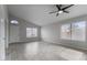 Bright living room features tile floors, vaulted ceiling, and lots of natural light from large windows at 2830 S Arroyo Ct, Chandler, AZ 85286