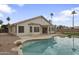 Backyard view showcasing a sparkling swimming pool and covered patio, perfect for outdoor entertainment and relaxation at 2830 S Arroyo Ct, Chandler, AZ 85286