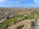 Aerial view showing a golf course and surrounding community at 29840 N 43Rd Way, Cave Creek, AZ 85331