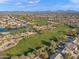 Aerial view of community near a golf course and lake at 29840 N 43Rd Way, Cave Creek, AZ 85331