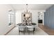 Modern dining room with dark wood table and plush seating at 29840 N 43Rd Way, Cave Creek, AZ 85331