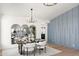 Modern dining room features a statement wall and elegant table setting at 29840 N 43Rd Way, Cave Creek, AZ 85331