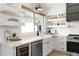 Stylish kitchen with white shaker cabinets and quartz countertops at 29840 N 43Rd Way, Cave Creek, AZ 85331