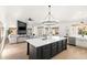 Open concept kitchen with island and view into living room at 29840 N 43Rd Way, Cave Creek, AZ 85331