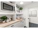 Modern kitchen with a butlers pantry and wood-look tile at 29840 N 43Rd Way, Cave Creek, AZ 85331