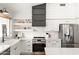 White kitchen with stainless steel appliances and farmhouse sink at 29840 N 43Rd Way, Cave Creek, AZ 85331