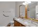 Bathroom with granite double vanity, large mirror, and walk-in shower at 29874 N Little Leaf Dr, San Tan Valley, AZ 85143