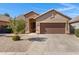 Single-story home with stone accents and a two-car garage at 29874 N Little Leaf Dr, San Tan Valley, AZ 85143