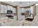 Spacious kitchen featuring granite countertops and white cabinets at 29874 N Little Leaf Dr, San Tan Valley, AZ 85143