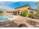Expansive backyard featuring a swimming pool, patio, and low-maintenance landscaping at 3501 E Apricot Ln, Gilbert, AZ 85298