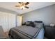 Comfortable bedroom with a king-size bed and double doors to the closet at 3501 E Apricot Ln, Gilbert, AZ 85298