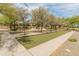 Bocce ball court within the community with lush trees and benches for relaxing games at 3501 E Apricot Ln, Gilbert, AZ 85298