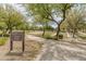 Beautiful park view featuring walking path, basketball court, putting green and mature trees in The Bridges at Gilbert at 3501 E Apricot Ln, Gilbert, AZ 85298