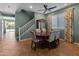 Bright dining area with staircase, classic furniture and outdoor pool view at 3501 E Apricot Ln, Gilbert, AZ 85298