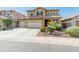 Two-story home featuring a three-car garage, desert landscaping, and a classic-style facade at 3501 E Apricot Ln, Gilbert, AZ 85298