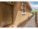 Welcoming front entrance with a solid door and charming exterior details at 3501 E Apricot Ln, Gilbert, AZ 85298