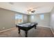 Fun game room with pool table and ceiling fan at 3501 E Apricot Ln, Gilbert, AZ 85298