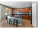 Modern kitchen with granite counters, stainless steel appliances, and an island with bar stool seating at 3501 E Apricot Ln, Gilbert, AZ 85298