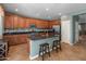 Spacious kitchen with granite countertops, stainless steel appliances, and an island with seating at 3501 E Apricot Ln, Gilbert, AZ 85298