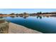 Serene community lake with walking paths and benches at 3501 E Apricot Ln, Gilbert, AZ 85298