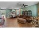 Open-concept living room featuring tile floors, and an adjacent dining area at 3501 E Apricot Ln, Gilbert, AZ 85298
