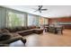 Open living and dining area with wood flooring and kitchen views at 3501 E Apricot Ln, Gilbert, AZ 85298