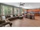 Spacious living room featuring tile floors, a large sectional sofa and ample natural light at 3501 E Apricot Ln, Gilbert, AZ 85298