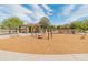 Community playground with swings, climbing area, and picnic pavilion for Gathering enjoyment at 3501 E Apricot Ln, Gilbert, AZ 85298