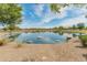 Community pond, gravel shores and mature trees at 3501 E Apricot Ln, Gilbert, AZ 85298