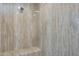 Elegant shower with a built-in bench and marble-like walls at 3501 E Apricot Ln, Gilbert, AZ 85298