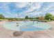 Community splash pad with colorful water features and playground equipment in The Bridges at Gilbert at 3501 E Apricot Ln, Gilbert, AZ 85298