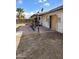 Small backyard patio with gravel and a damaged door at 3510 W Seldon Ln, Phoenix, AZ 85051